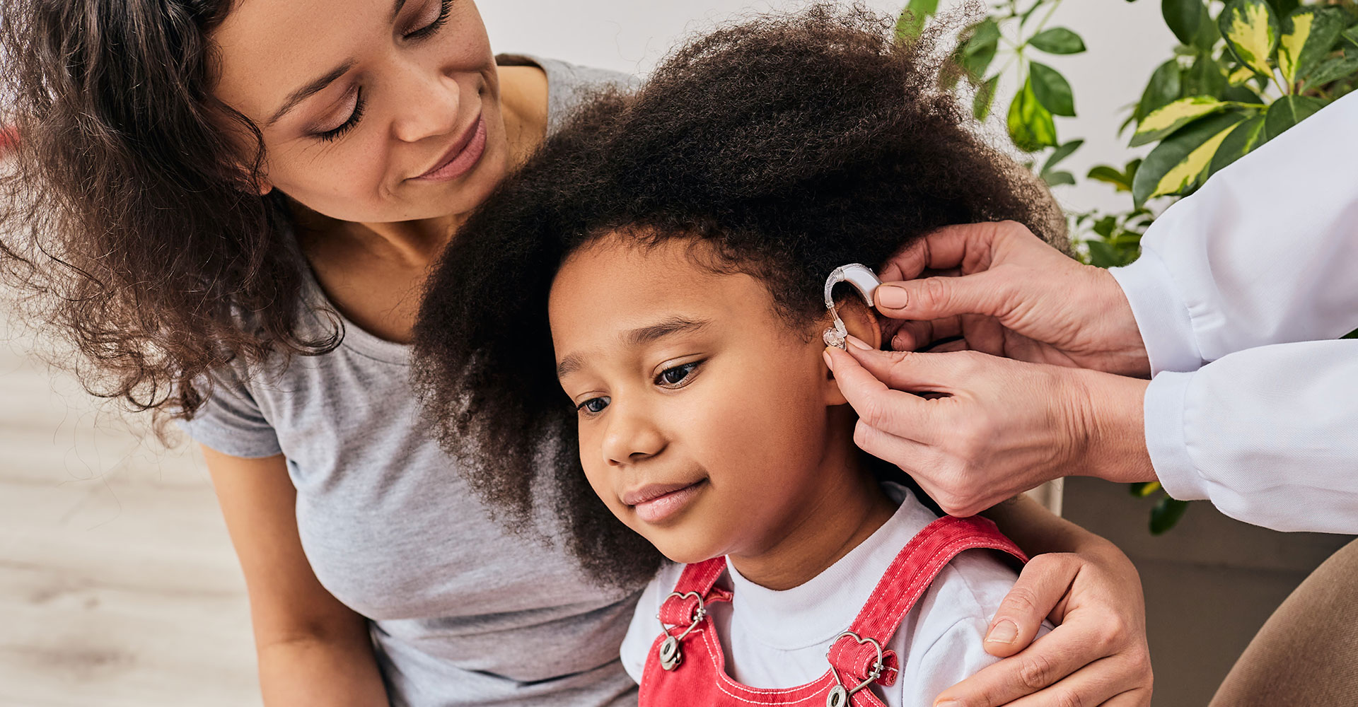 Young girl getting fit for a hearing aid